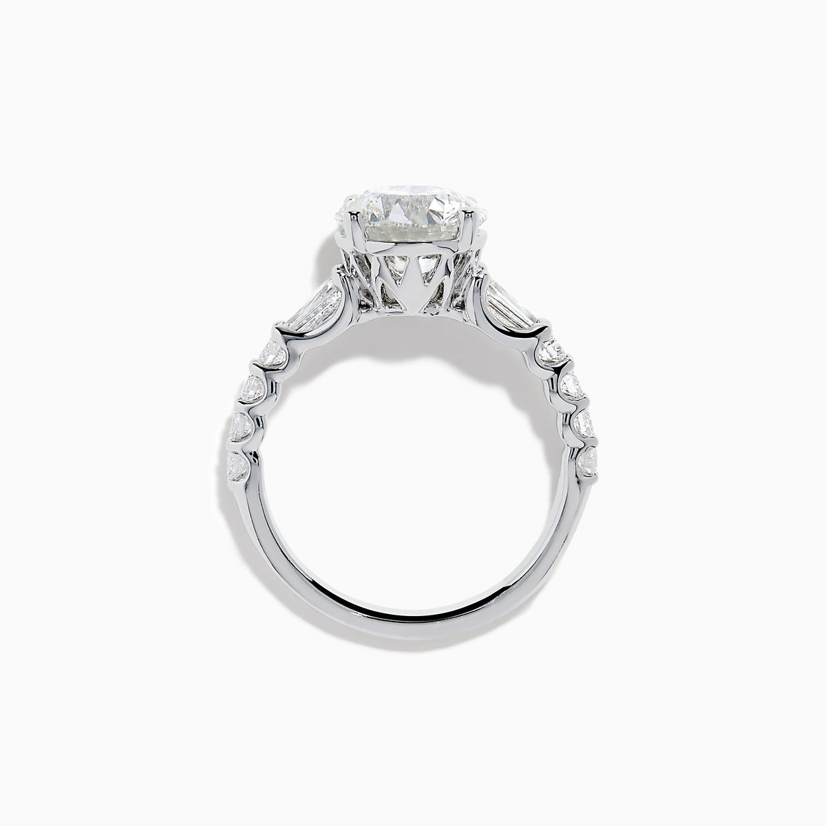 The Star Lab Grown Diamond Ring in 18K White Gold showcases a large oval-cut center stone with baguette and round accents along the band, elegantly presented on a white background.