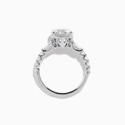 The Star Lab Grown Diamond Ring in 18K White Gold showcases a large oval-cut center stone with baguette and round accents along the band, elegantly presented on a white background.