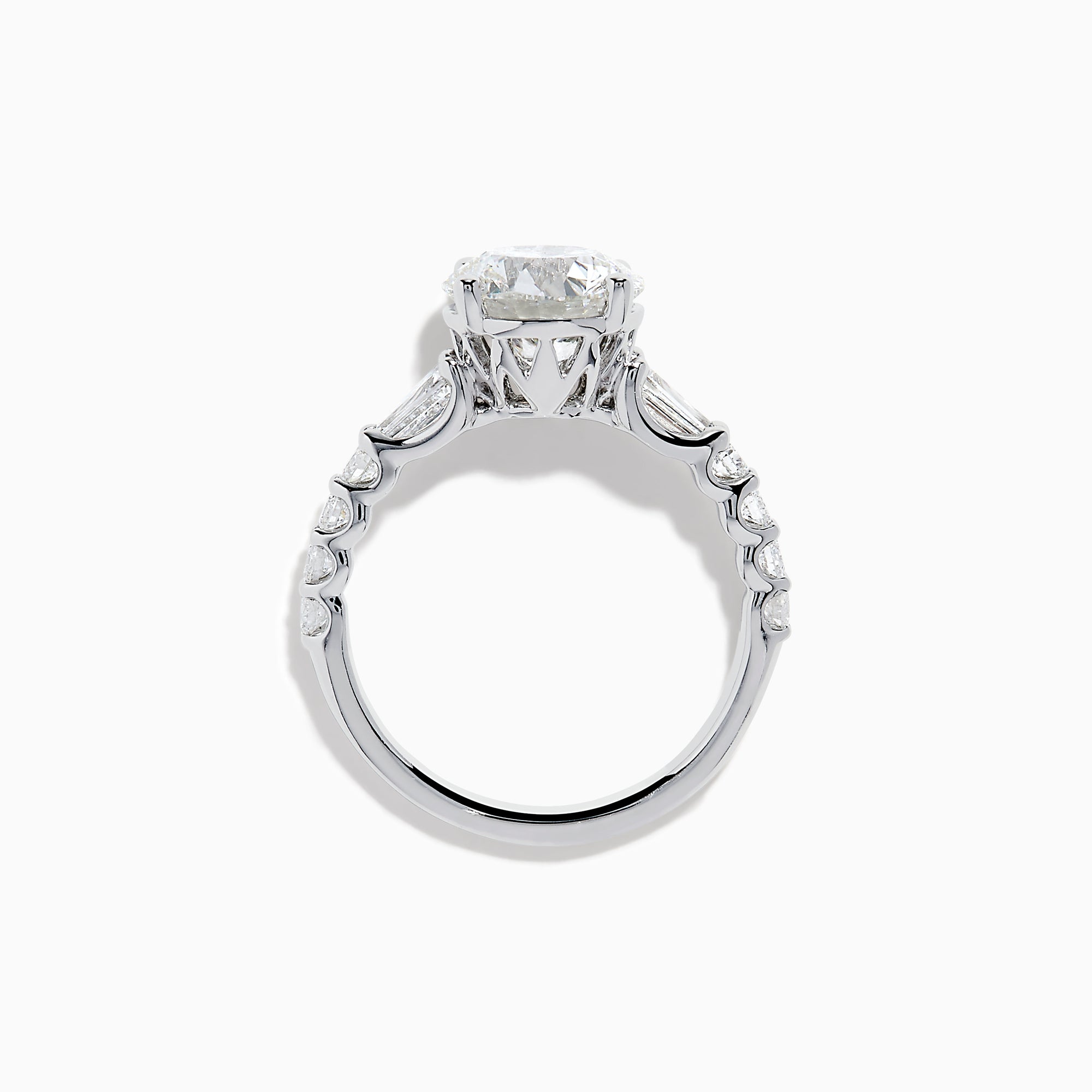 The Star Lab Grown Diamond Ring in 18K White Gold showcases a large oval-cut center stone with baguette and round accents along the band, elegantly presented on a white background.