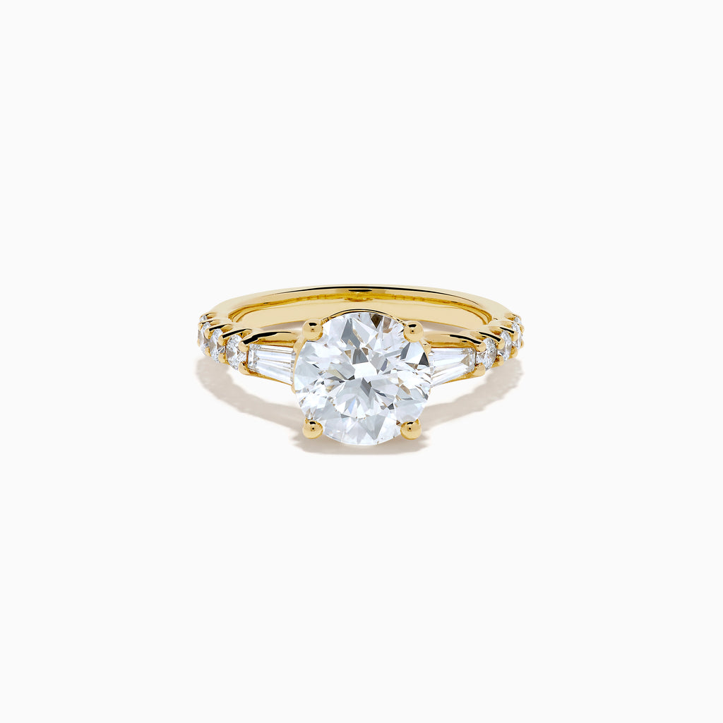 The Star Lab Grown Diamond Ring in 18K Yellow Gold showcases a large oval-cut lab diamond center stone with smaller rectangular accents along the band, elegantly displayed on a plain white background.