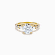 The Star Lab Grown Diamond Ring in 18K Yellow Gold showcases a large oval-cut lab diamond center stone with smaller rectangular accents along the band, elegantly displayed on a plain white background.