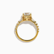 The Star Lab Grown Diamond Ring in 18K Yellow Gold showcases a large oval-cut lab diamond center stone with smaller rectangular accents along the band, elegantly displayed on a plain white background.