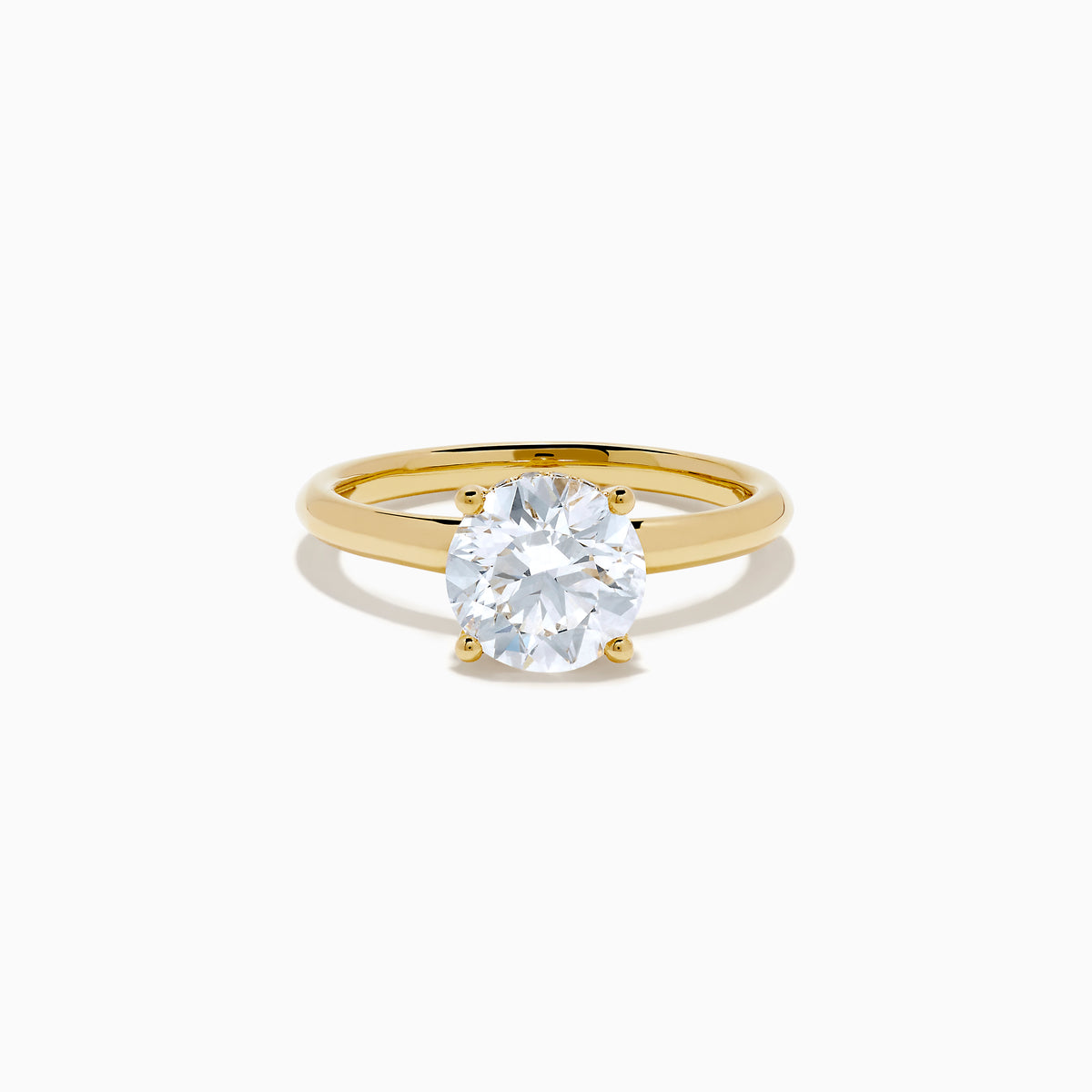 The Star Lab Grown Diamond Vine Ring in 18K yellow gold features a large round lab diamond in a classic prong setting, shown on a white background.