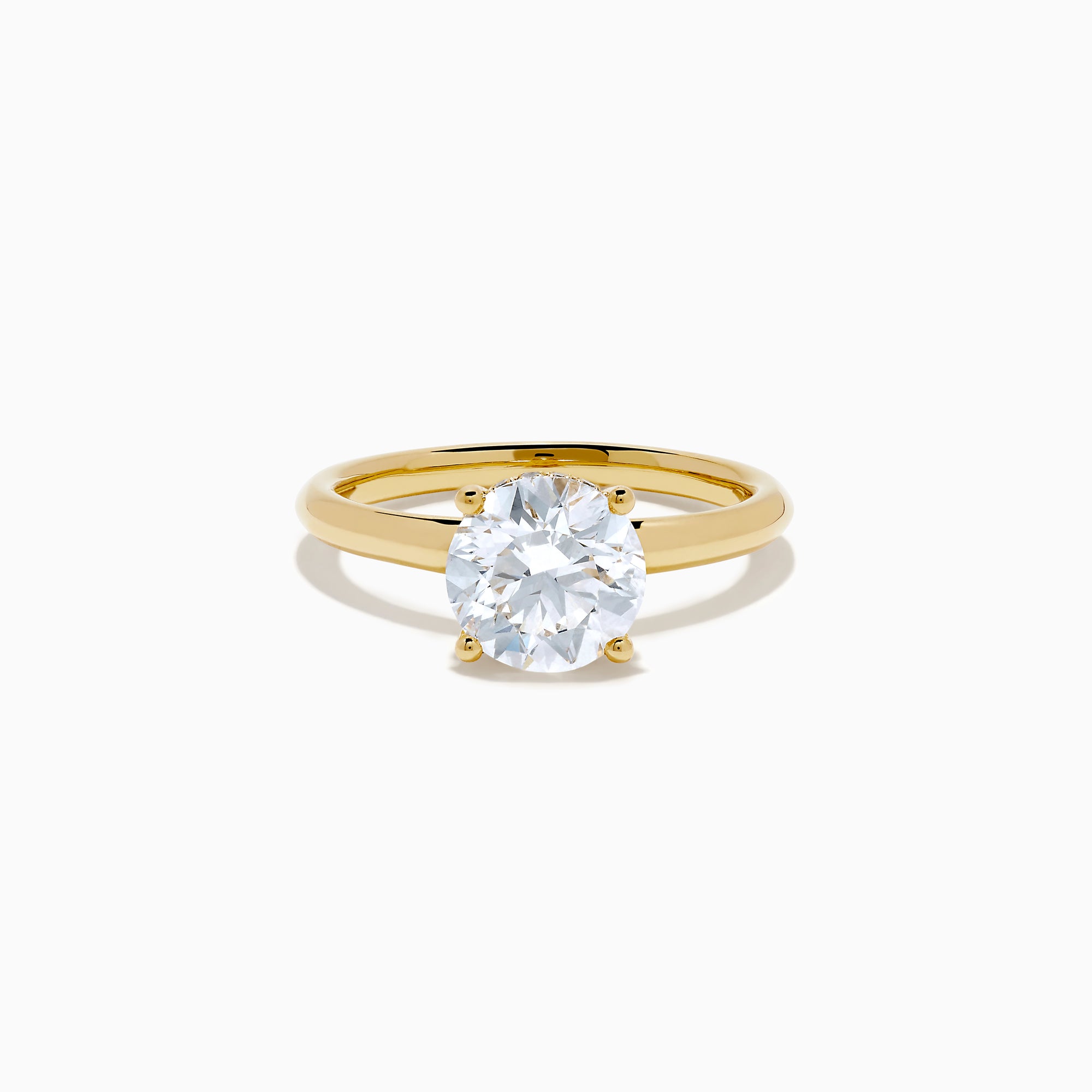 The Star Lab Grown Diamond Vine Ring in 18K yellow gold features a large round lab diamond in a classic prong setting, shown on a white background.