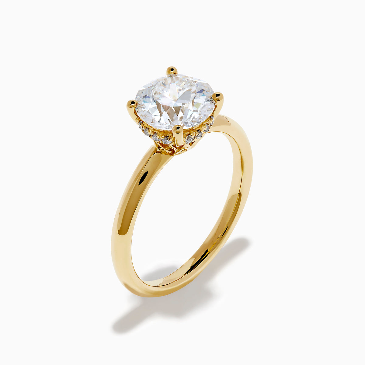The Star Lab Grown Diamond Vine Ring in 18K yellow gold features a large round lab diamond in a classic prong setting, shown on a white background.