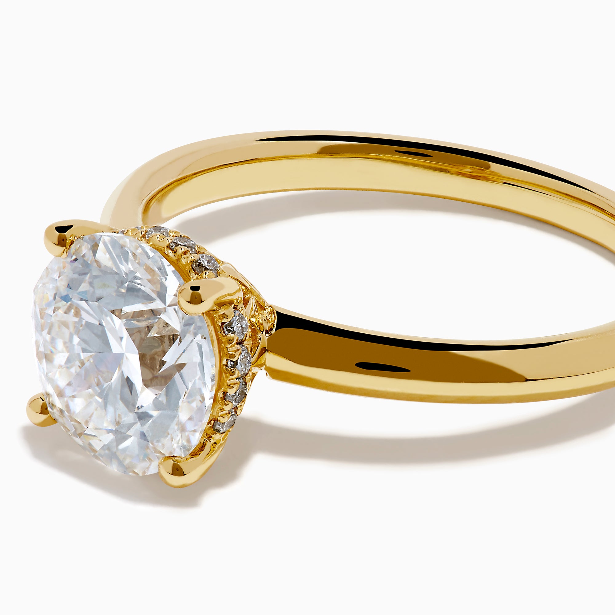 The Star Lab Grown Diamond Vine Ring in 18K yellow gold features a large round lab diamond in a classic prong setting, shown on a white background.