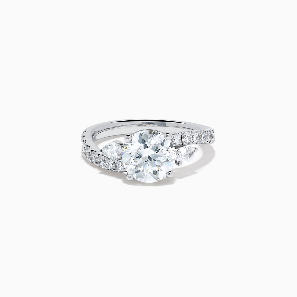 The Star Lab Grown Diamond Vine Ring in 18K White Gold features a large round lab-grown diamond center, accented with smaller diamonds along the band and an elegant vine twist design—an exquisite statement piece.