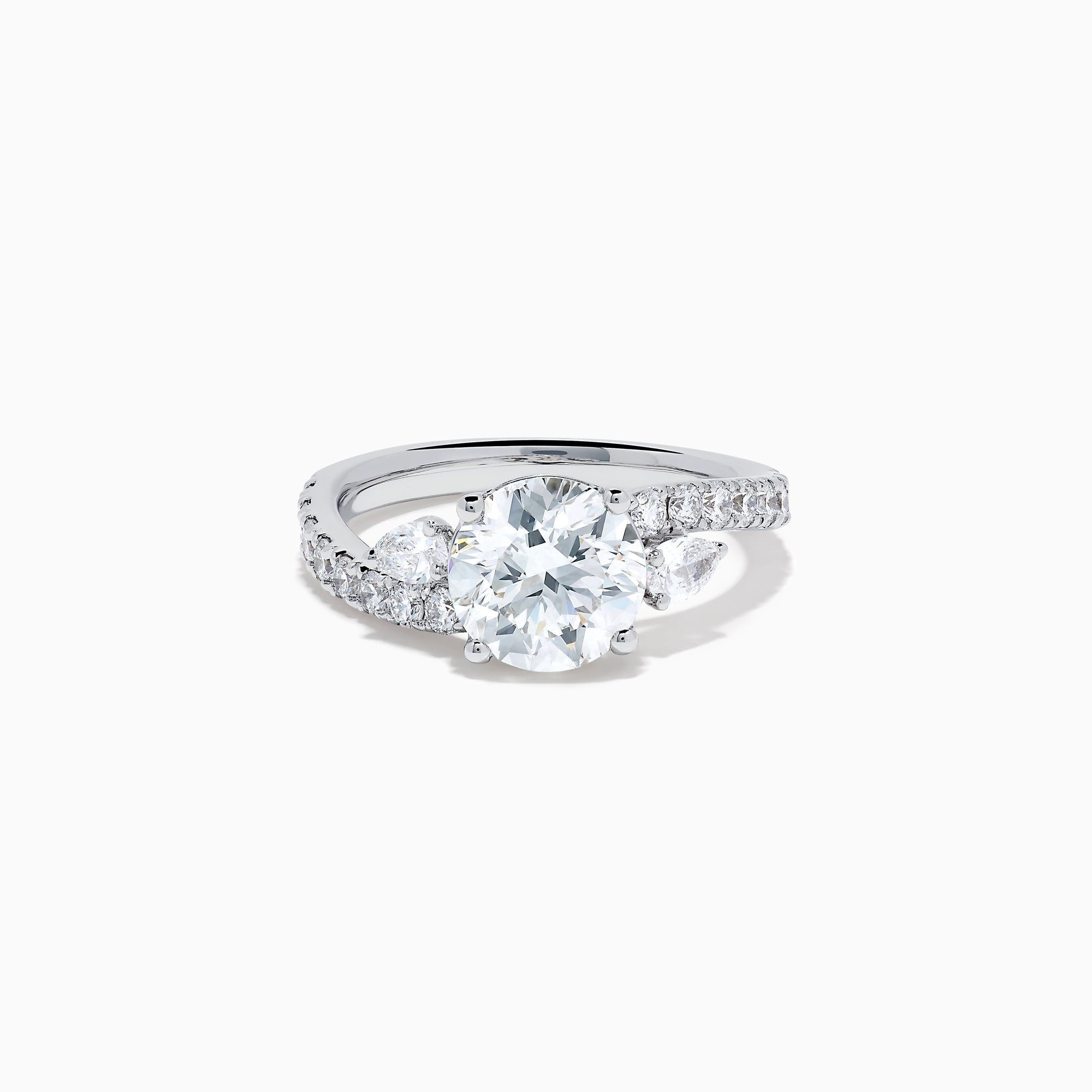 The Star Lab Grown Diamond Vine Ring in 18K White Gold features a large round lab-grown diamond center, accented with smaller diamonds along the band and an elegant vine twist design—an exquisite statement piece.