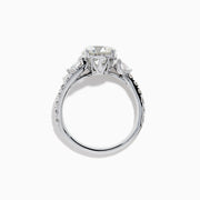 The Star Lab Grown Diamond Vine Ring in 18K White Gold features a large round lab-grown diamond center, accented with smaller diamonds along the band and an elegant vine twist design—an exquisite statement piece.