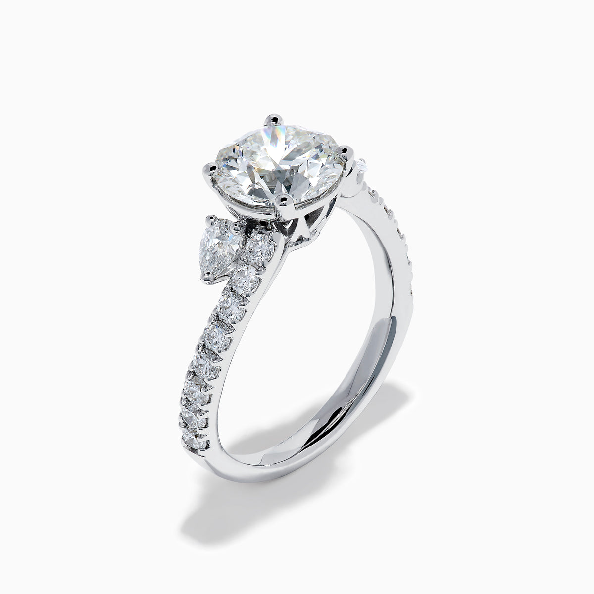 The Star Lab Grown Diamond Vine Ring in 18K White Gold features a large round lab-grown diamond center, accented with smaller diamonds along the band and an elegant vine twist design—an exquisite statement piece.