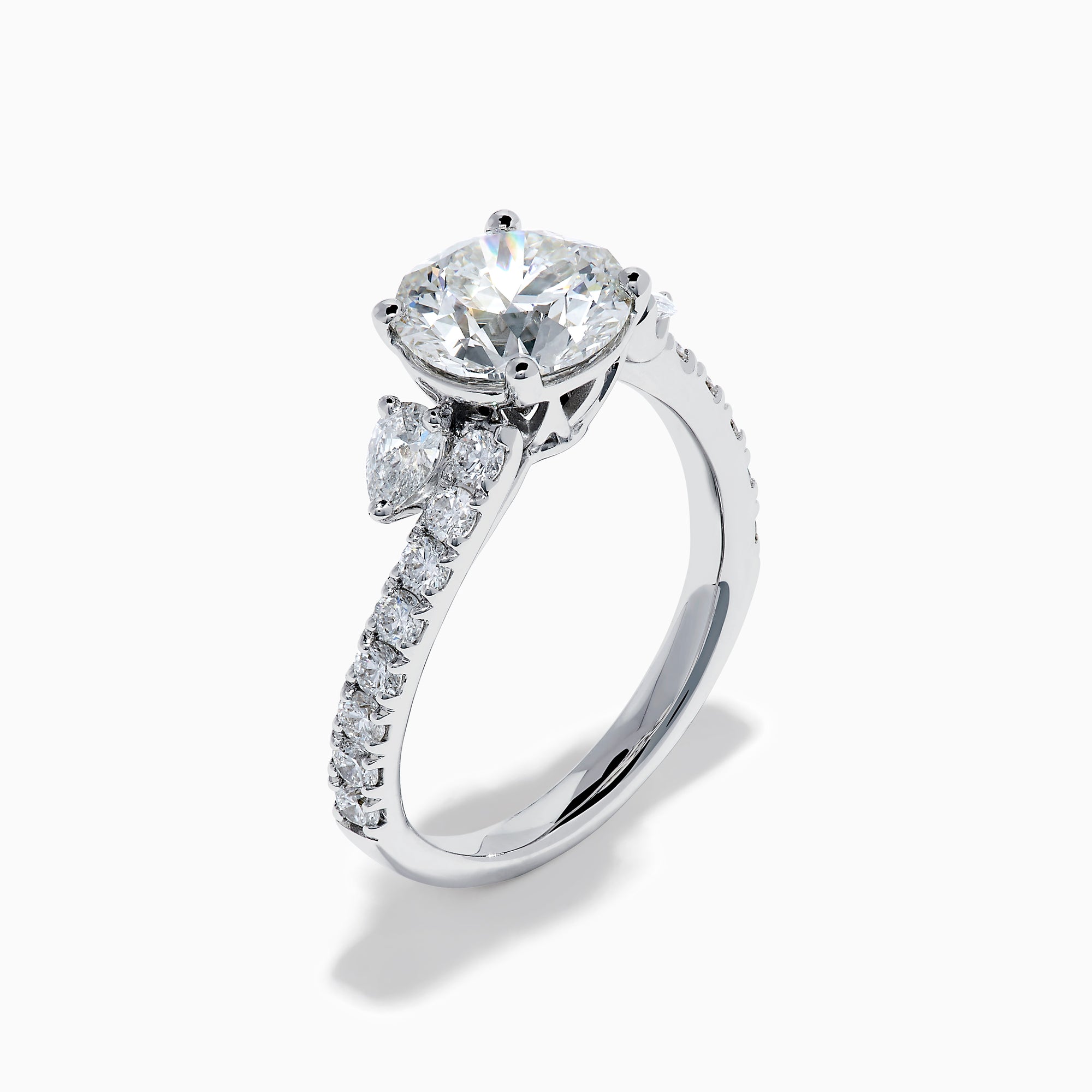 The Star Lab Grown Diamond Vine Ring in 18K White Gold features a large round lab-grown diamond center, accented with smaller diamonds along the band and an elegant vine twist design—an exquisite statement piece.