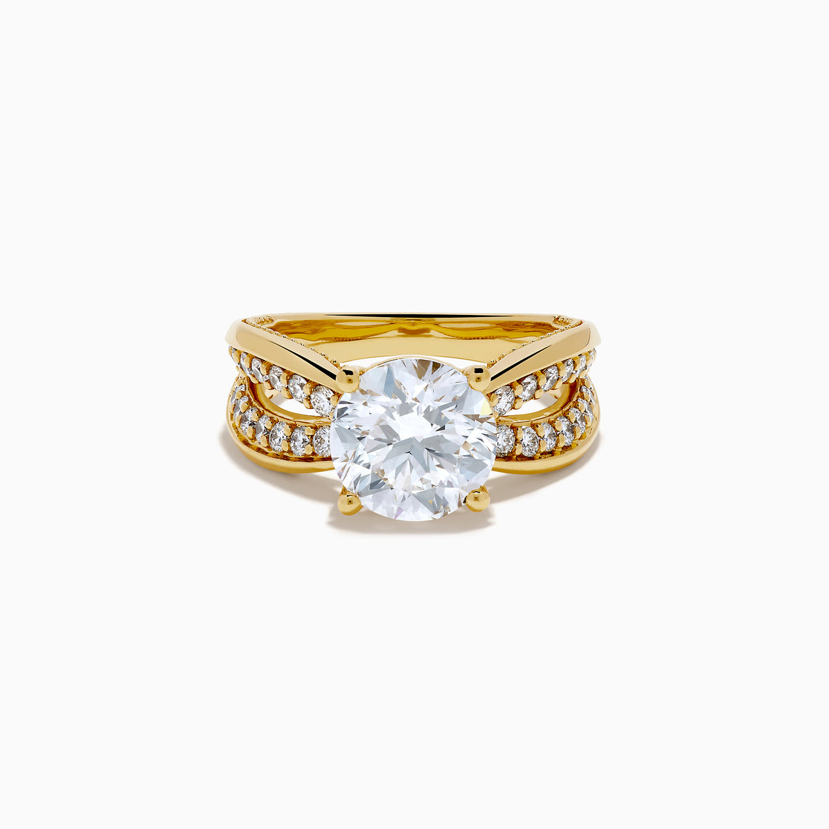 The Star Lab Grown Diamond Embrace Ring in 18K Yellow Gold showcases a prominent round lab-grown diamond center, with rows of smaller diamonds along the band and detailed side designs.
