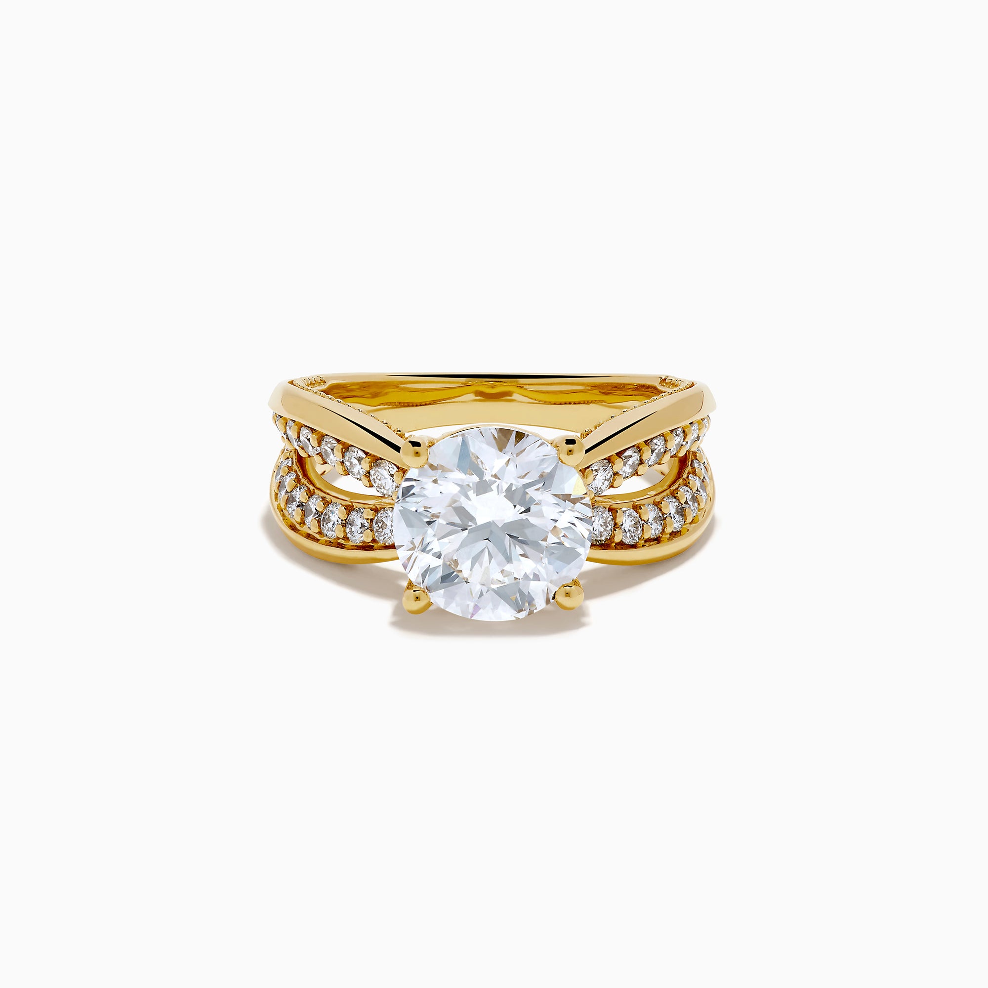 The Star Lab Grown Diamond Embrace Ring in 18K Yellow Gold showcases a prominent round lab-grown diamond center, with rows of smaller diamonds along the band and detailed side designs.