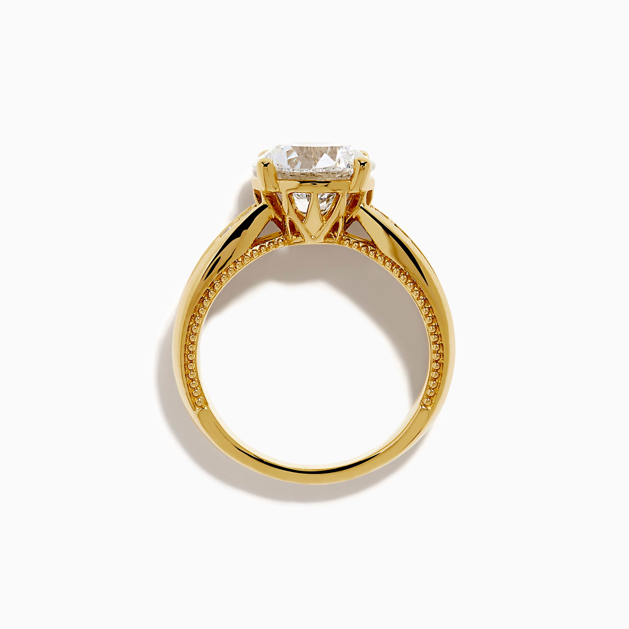 The Star Lab Grown Diamond Embrace Ring in 18K Yellow Gold showcases a prominent round lab-grown diamond center, with rows of smaller diamonds along the band and detailed side designs.
