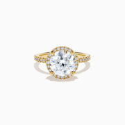 The Star Lab Grown Diamond Halo Ring in 18K Yellow Gold showcases a large oval lab diamond center, encircled by a halo of star lab diamonds and additional diamonds along the band for extra brilliance.