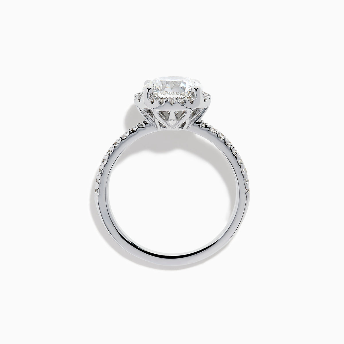 The Star Lab Grown Diamond Halo Ring in 18K White Gold features a large round lab diamond center, encircled by a sparkling halo and delicate stones on the band, shown against a white background.