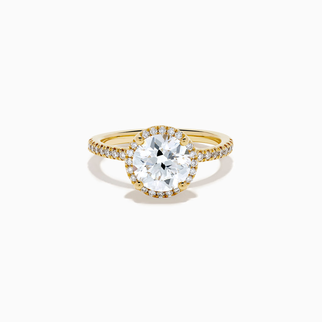 The Star Lab Grown Diamond Halo Ring in 18K Yellow Gold showcases an oval lab-grown diamond center, surrounded by a sparkling diamond halo and accented with diamonds along the band.