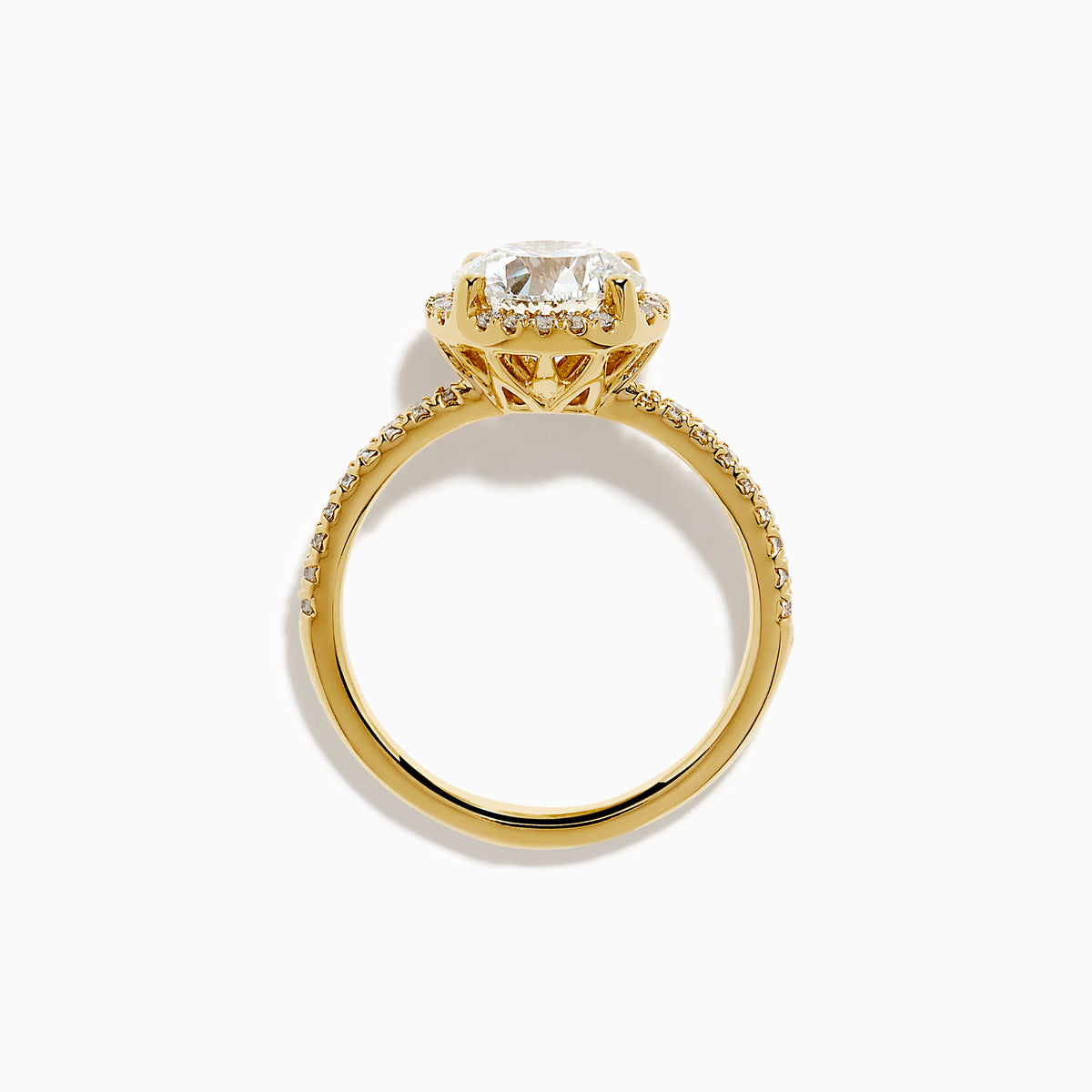The Star Lab Grown Diamond Halo Ring in 18K Yellow Gold showcases an oval lab-grown diamond center, surrounded by a sparkling diamond halo and accented with diamonds along the band.