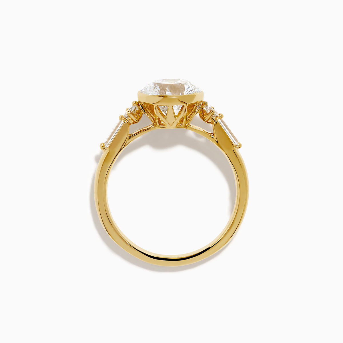 The Star Lab Grown Diamond Moderne Ring in 18K Yellow Gold features a large round lab diamond center, two smaller round diamonds, and baguette-cut side diamonds, shown on a white background.