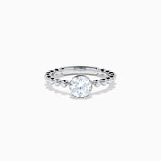 The Star Lab Grown Diamond Solitaire Beaded Ring in 18K White Gold features a round lab diamond center accented by polished beaded details along the band, shown on a white background.