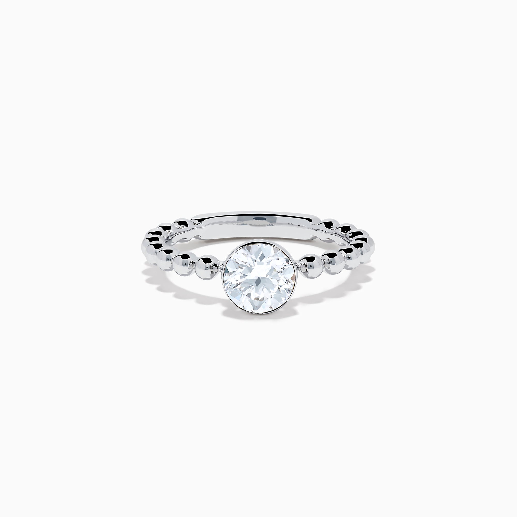 The Star Lab Grown Diamond Solitaire Beaded Ring in 18K White Gold features a round lab diamond center accented by polished beaded details along the band, shown on a white background.