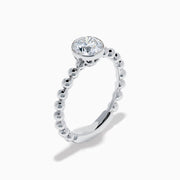 The Star Lab Grown Diamond Solitaire Beaded Ring in 18K White Gold features a round lab diamond center accented by polished beaded details along the band, shown on a white background.
