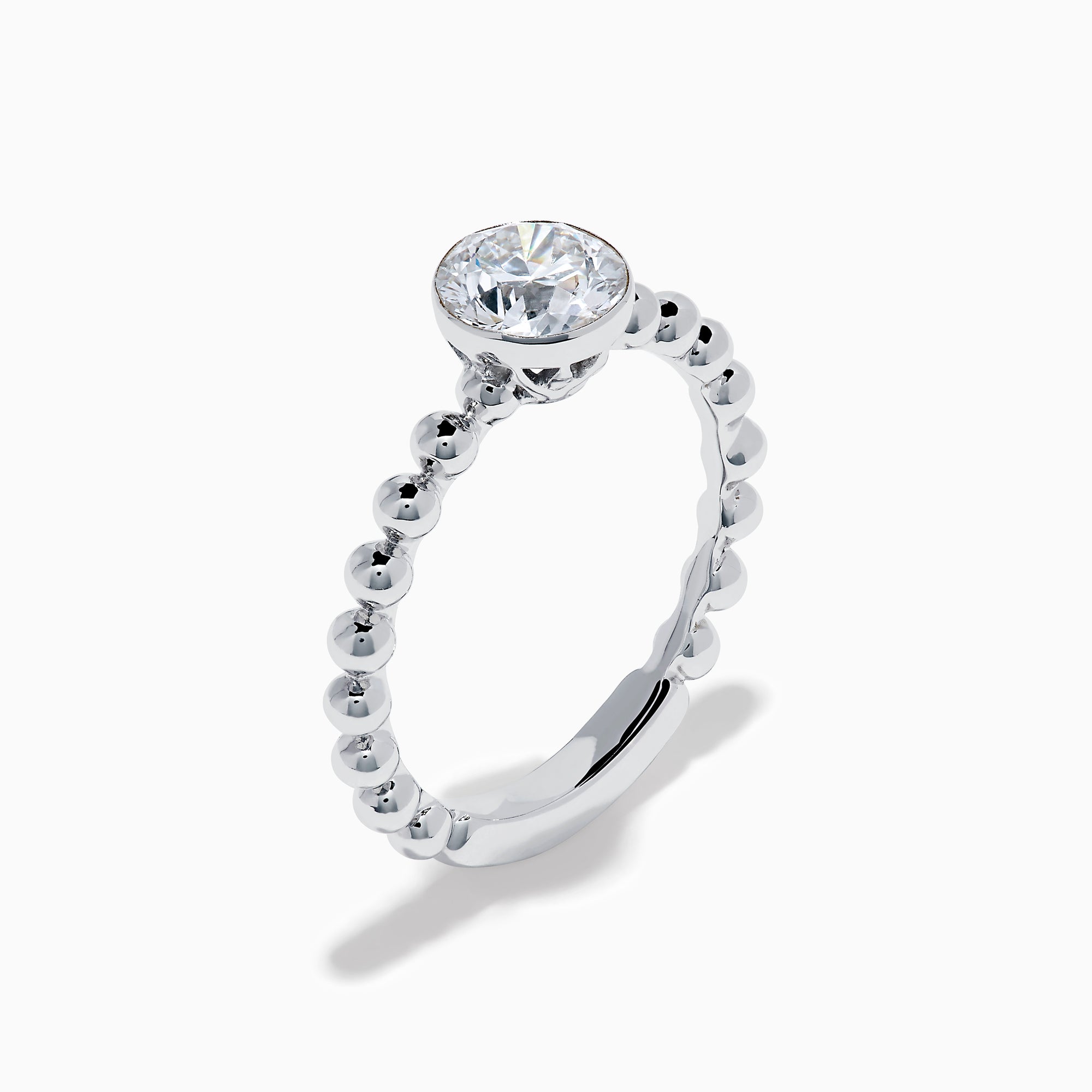 The Star Lab Grown Diamond Solitaire Beaded Ring in 18K White Gold features a round lab diamond center accented by polished beaded details along the band, shown on a white background.