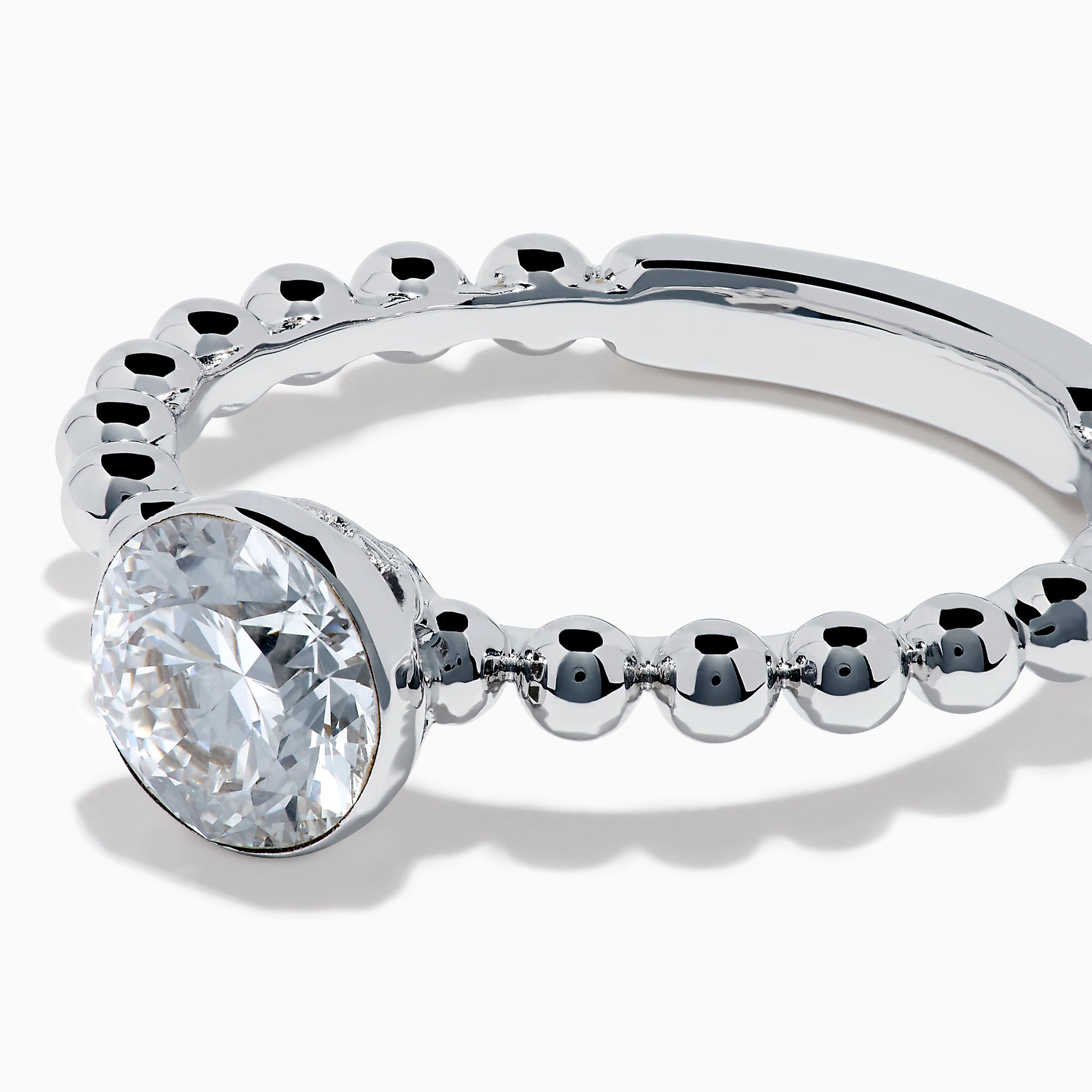 The Star Lab Grown Diamond Solitaire Beaded Ring in 18K White Gold features a round lab diamond center accented by polished beaded details along the band, shown on a white background.