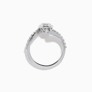 The Star Lab Grown Diamond Connect Ring in 18K White Gold showcases a striking round center stone, with an elegantly twisting band highlighted by sparkling side diamonds for extra brilliance.