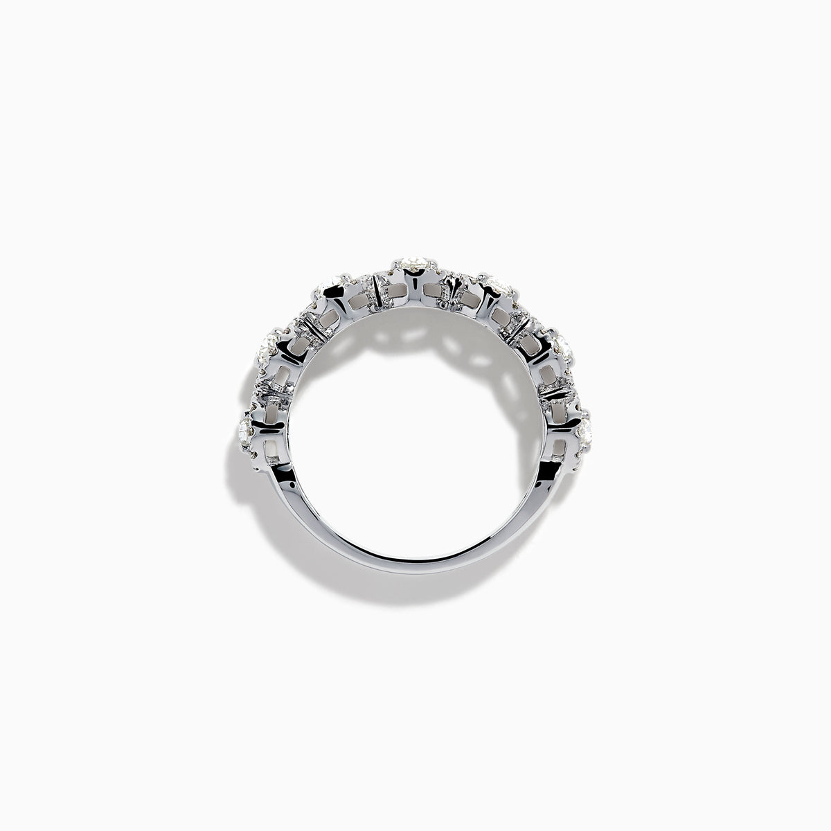 The 18K White Gold Diamond Oval Halo Band Ring showcases large oval-cut diamonds, each surrounded by a sparkling halo of smaller stones, elegantly displayed on a white background.