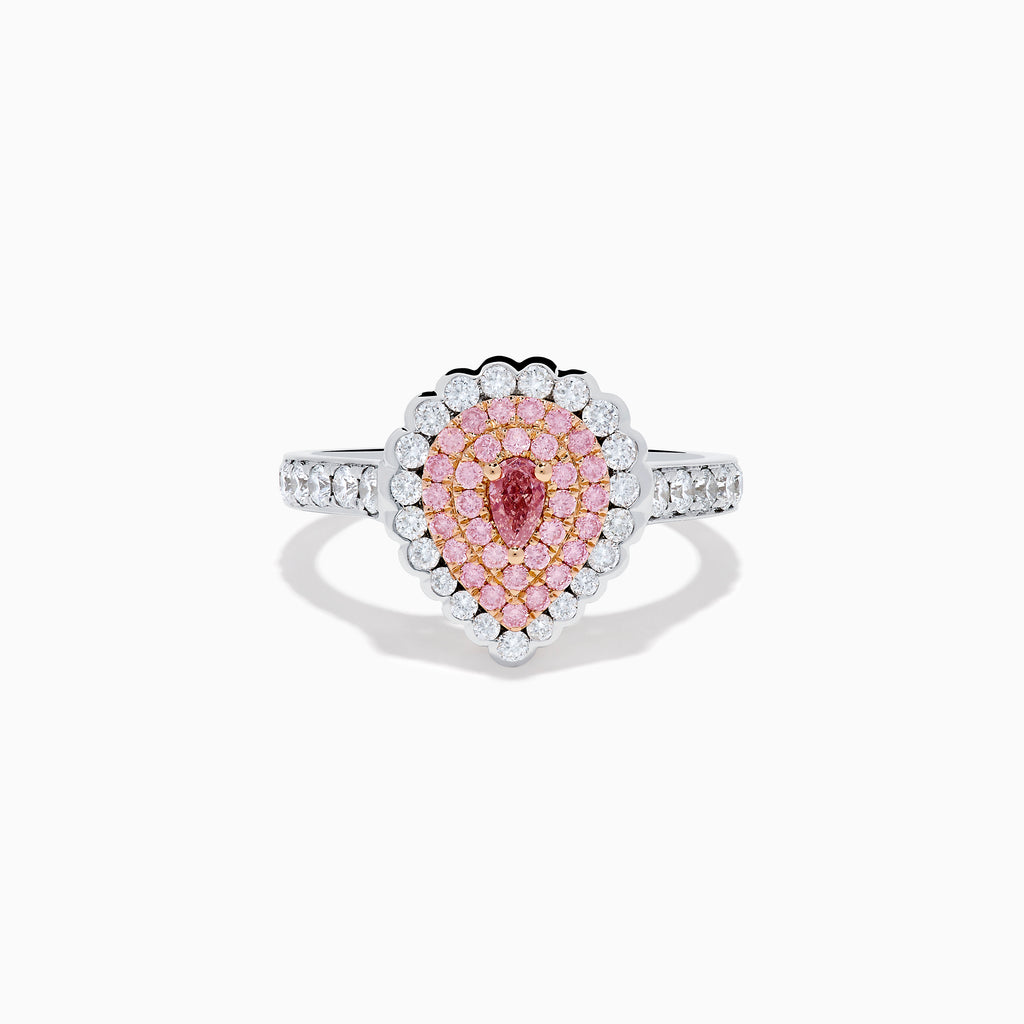 The 18K Two Tone Gold Pink and White Diamond Ring features a teardrop-shaped pink diamond cluster encircled by white diamonds, set on a two-tone gold band adorned with additional diamonds.