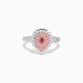 The 18K Two Tone Gold Pink and White Diamond Ring features a teardrop-shaped pink diamond cluster encircled by white diamonds, set on a two-tone gold band adorned with additional diamonds.