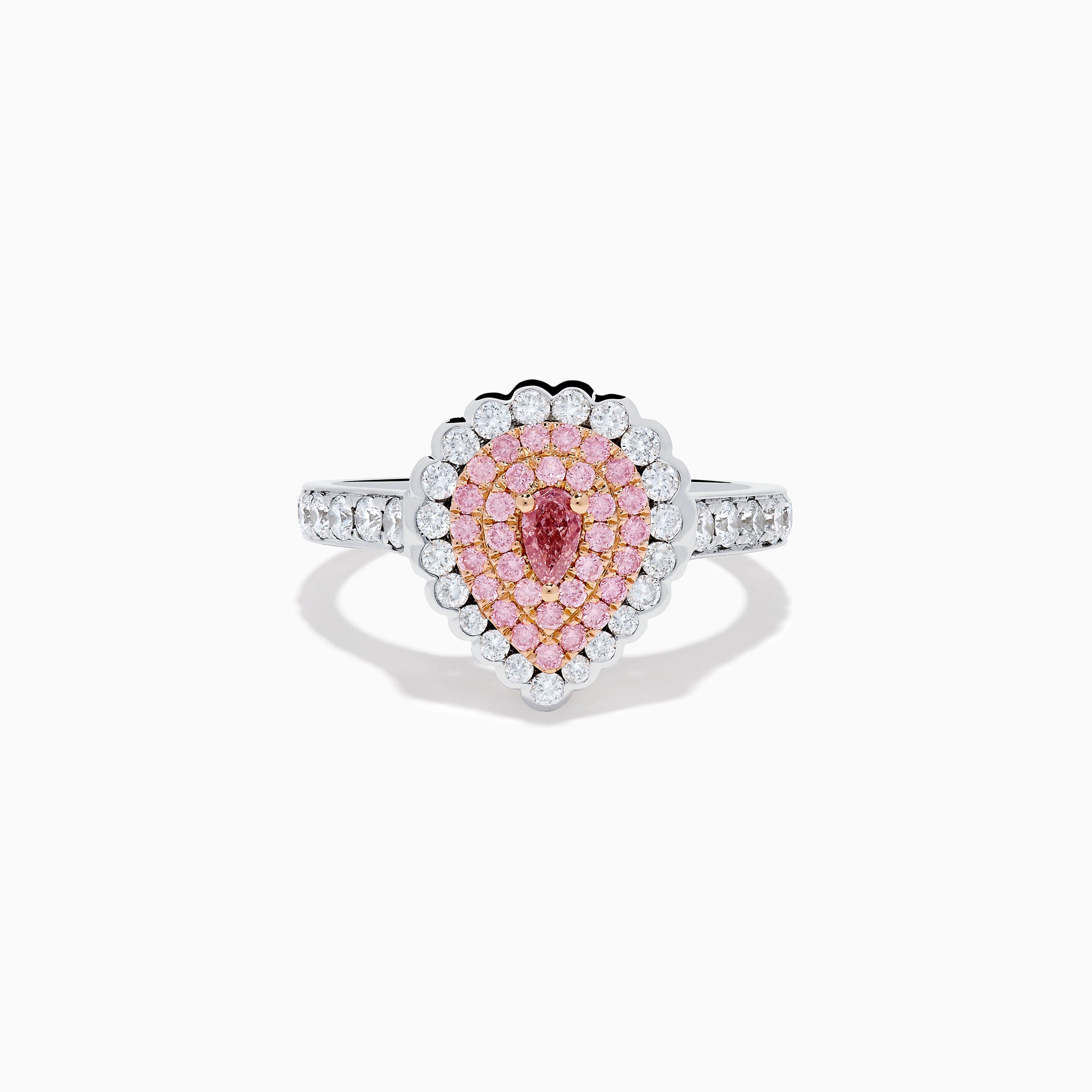 The 18K Two Tone Gold Pink and White Diamond Ring features a teardrop-shaped pink diamond cluster encircled by white diamonds, set on a two-tone gold band adorned with additional diamonds.