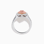 The 18K Two Tone Gold Pink and White Diamond Ring features a teardrop-shaped pink diamond cluster encircled by white diamonds, set on a two-tone gold band adorned with additional diamonds.