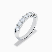 The 14K White Gold 7-Stone Prong Set Diamond Band, 1.00 TCW, features seven round diamonds set closely together along the top half of the band.