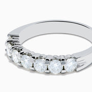 The 14K White Gold 7-Stone Prong Set Diamond Band, 1.00 TCW, features seven round diamonds set closely together along the top half of the band.
