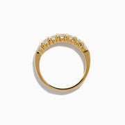 The 14K Yellow Gold 7-Stone Prong Set Diamond Band showcases a row of seven oval-cut white diamonds, totaling 1.00 TCW, displayed on a plain white background.