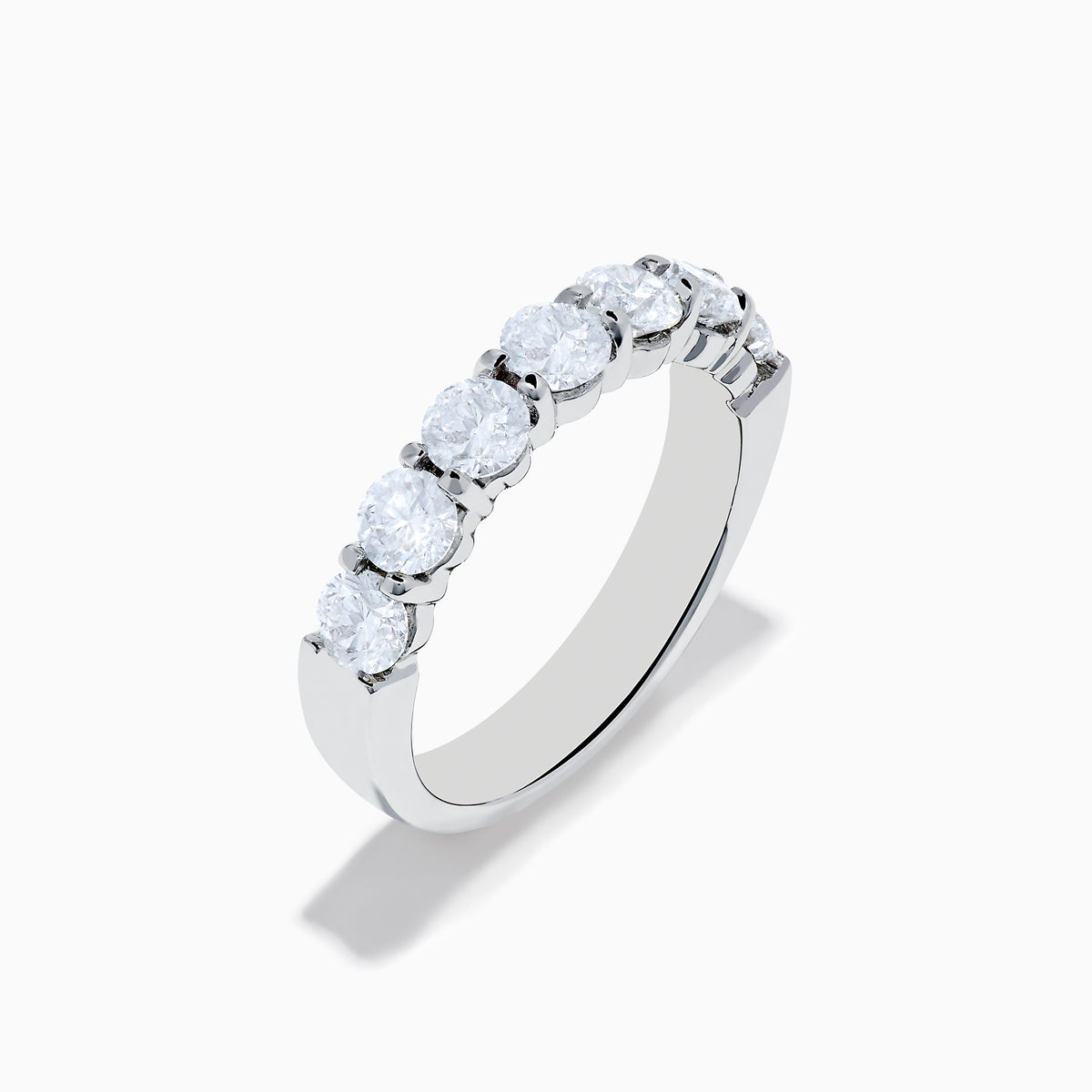 The 14K White Gold 7-Stone Prong Set Diamond Band, 1.50 TCW, features seven round diamonds set in a row and is shown on a plain white background.