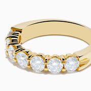 The 14K Yellow Gold 7-Stone Prong Set Diamond Band, 1.50 TCW, features a row of diamonds and is shown on a white background.