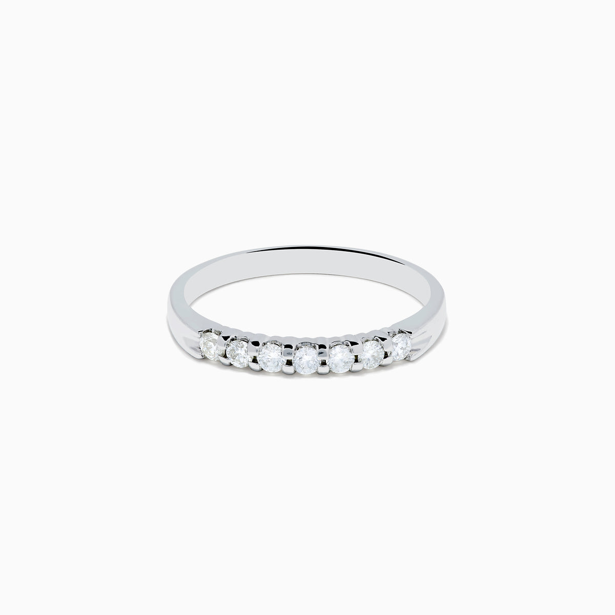 The 14K White Gold 7-Stone Prong Set Diamond Band, 0.25 TCW, showcases a row of seven round diamonds in prong settings across the top, shown on a plain white background.