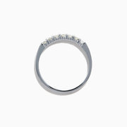 The 14K White Gold 7-Stone Prong Set Diamond Band, 0.25 TCW, showcases a row of seven round diamonds in prong settings across the top, shown on a plain white background.