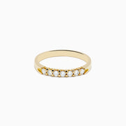 The 14K Yellow Gold 7-Stone Prong Set Diamond Band, 0.25 TCW, showcases a classic row of round white diamonds on a plain white background.