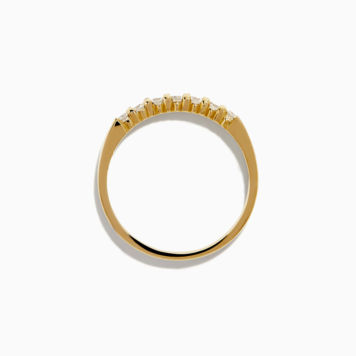 The 14K Yellow Gold 7-Stone Prong Set Diamond Band, 0.25 TCW, showcases a classic row of round white diamonds on a plain white background.