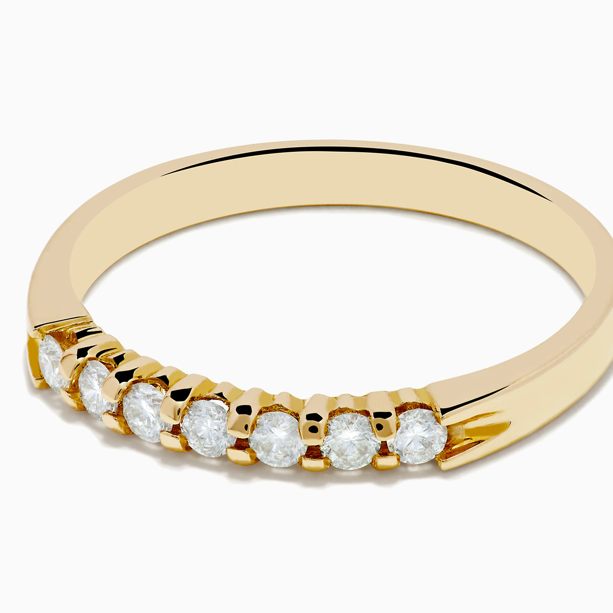 The 14K Yellow Gold 7-Stone Prong Set Diamond Band, 0.25 TCW, showcases a classic row of round white diamonds on a plain white background.