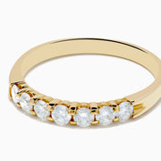 The 14K Yellow Gold 7-Stone Prong Set Diamond Band, 0.50 TCW, features a row of seven round white diamonds prong set across the top and is shown against a plain white background.