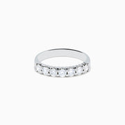 The 14K White Gold 7-Stone Prong Set Diamond Band, 0.75 TCW, showcases seven round diamonds set in a row along the band, displayed on a plain white background.