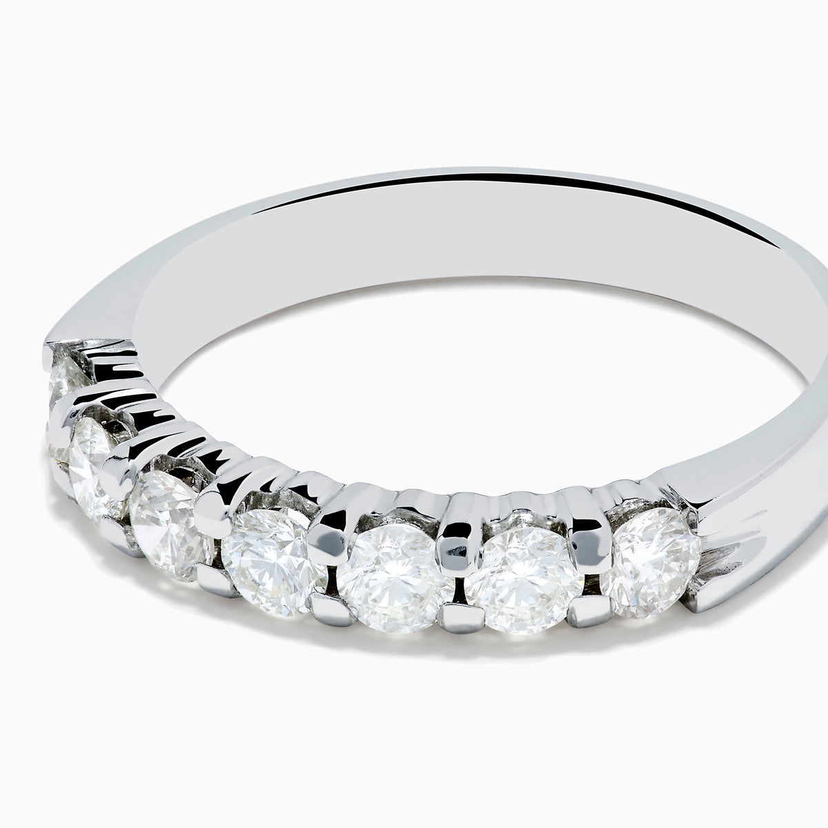 The 14K White Gold 7-Stone Prong Set Diamond Band, 0.75 TCW, showcases seven round diamonds set in a row along the band, displayed on a plain white background.