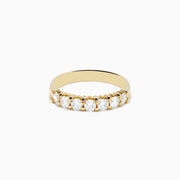 The 14K Yellow Gold 7-Stone Prong Set Diamond Band, 0.75 TCW, showcases a row of seven round diamonds set in yellow gold and displayed against a plain white background.