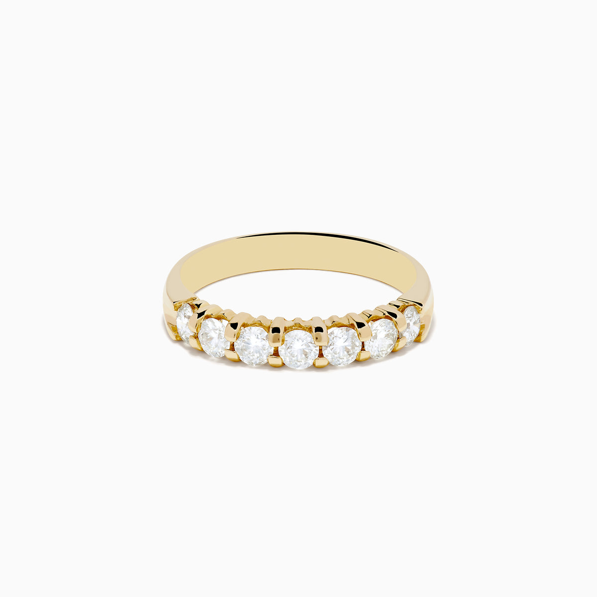 The 14K Yellow Gold 7-Stone Prong Set Diamond Band, 0.75 TCW, showcases a row of seven round diamonds set in yellow gold and displayed against a plain white background.