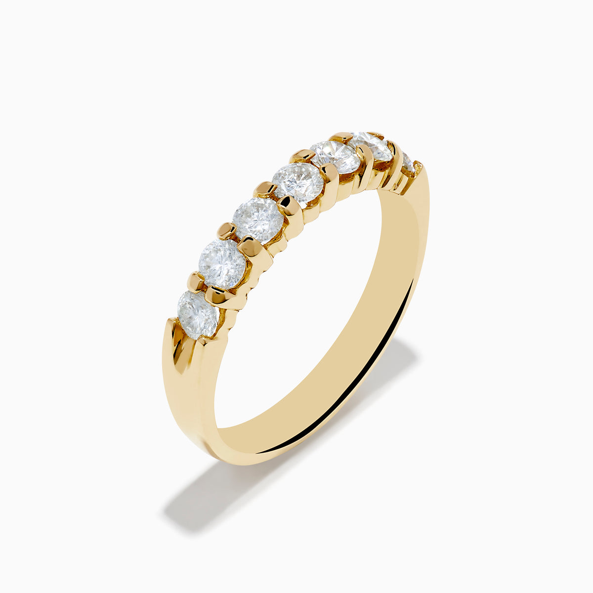 The 14K Yellow Gold 7-Stone Prong Set Diamond Band, 0.75 TCW, showcases a row of seven round diamonds set in yellow gold and displayed against a plain white background.